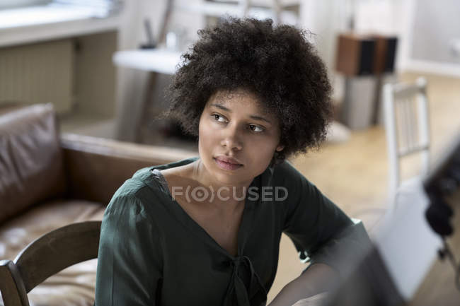 Portrait of serious young woman thinking — Stock Photo
