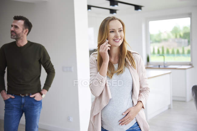 Couple looking around in empty flat — Stock Photo