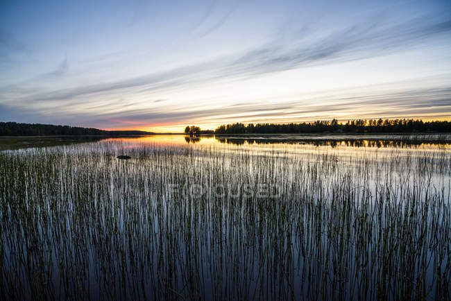 Finland, Kjaani, Kajaani river at sunset — Stock Photo
