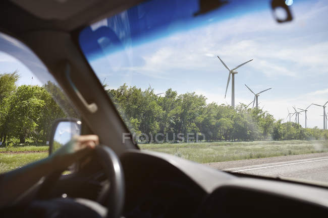 UK, Scotland, wind turbines seen from car — Stock Photo