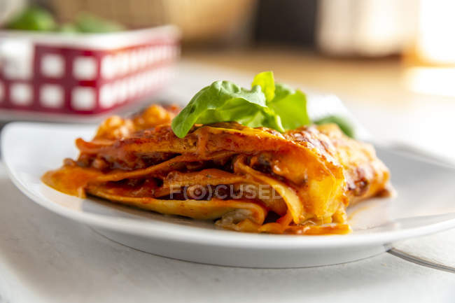 Vegetarian lasagne bolognese with basil and tomato — Stock Photo