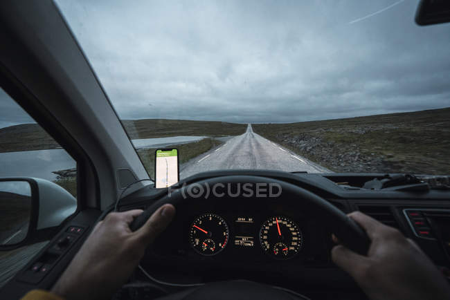 Young man driving car in Lapland, Norway — Stock Photo