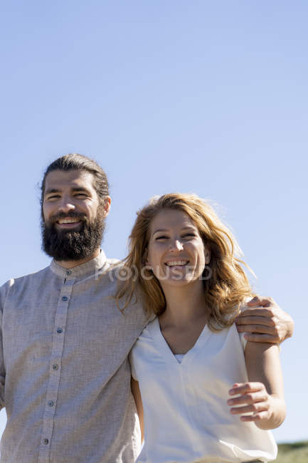 Portrait of a happy couple against clear sky — Stock Photo