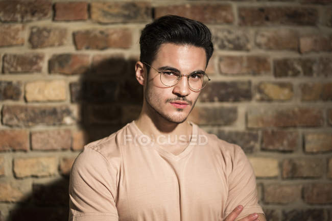 Portrait of handsome Caucasian man posing and looking at camera, serious face — Stock Photo