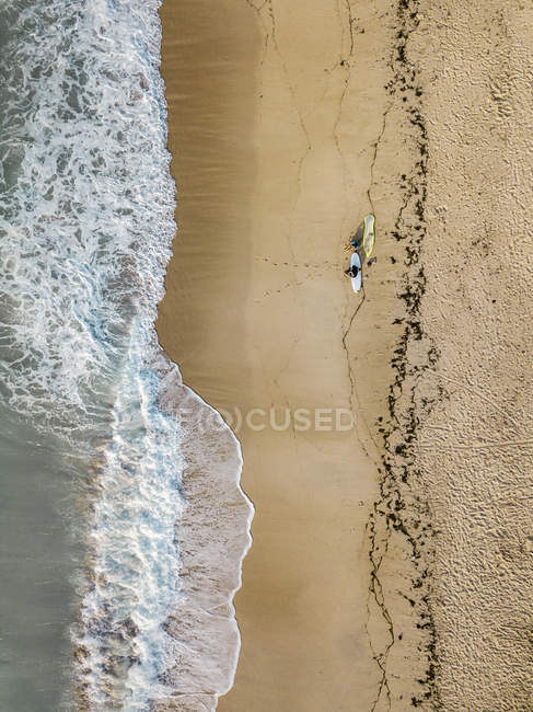 Indonesia, Bali, Aerial view of Pandawa beach, two surfers — Stock Photo