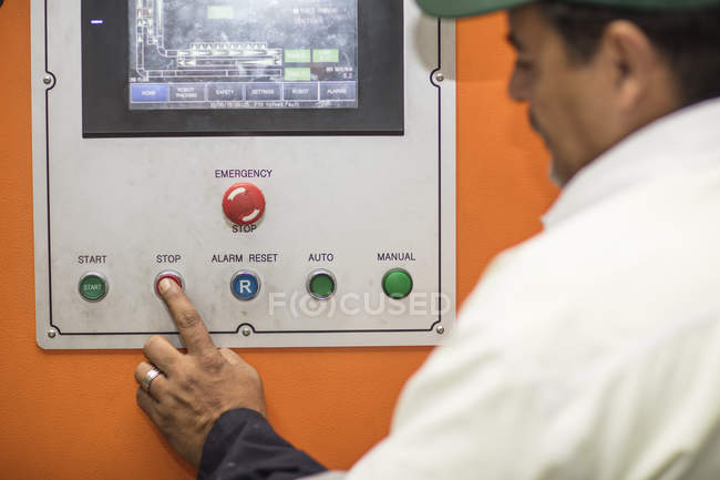 Worker using control panel — Stock Photo