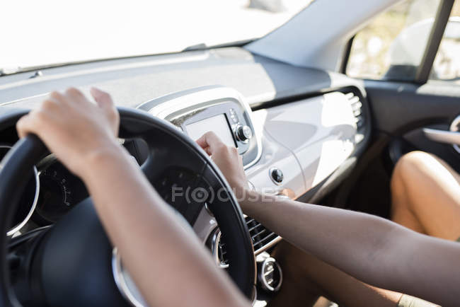 Hands on a steering wheel, driving a car — Stock Photo