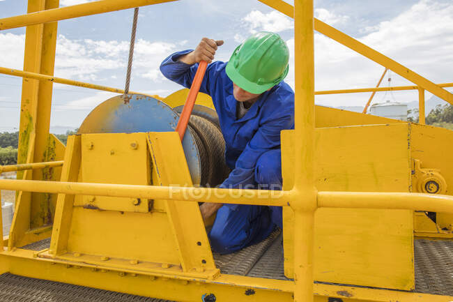 Construction worker working on crane — Stock Photo