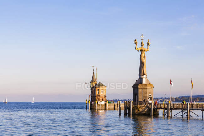 Germany, Constance, view to port entrance with lighthouse and Imperia — Stock Photo