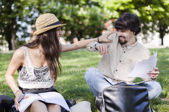 Two students having fun in a park — Stock Photo