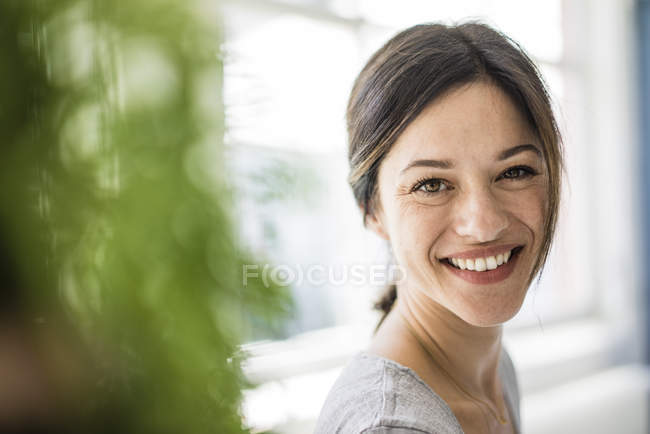 Portrait of a laughing woman looking at camera — Stock Photo