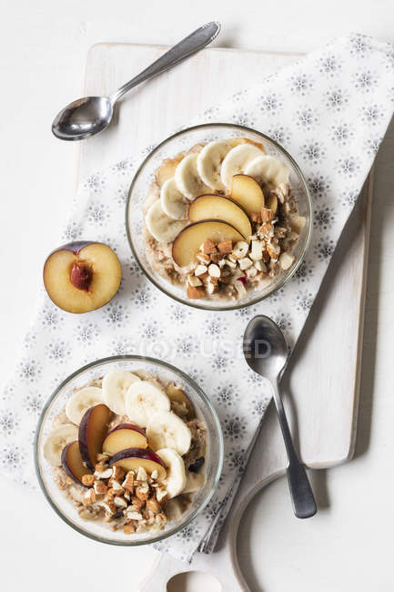 Cereals with banana and plum — Stock Photo