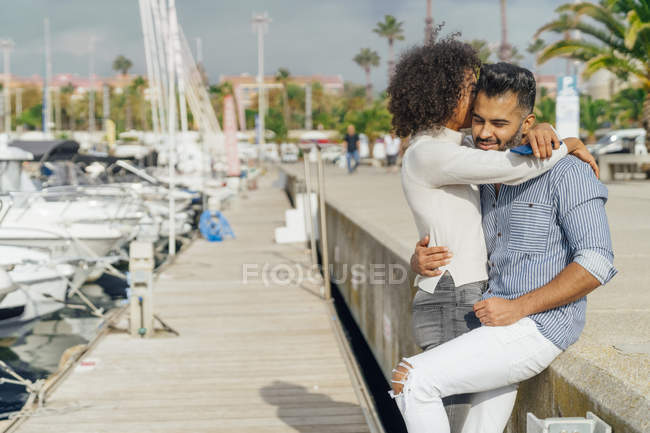 Spain, Barcelona, happy couple hugging at the marina — Stock Photo