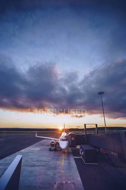 View of parking airplane at twilight — Stock Photo