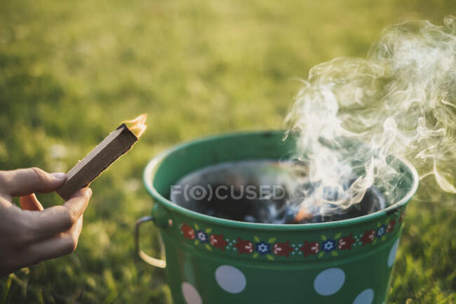 Woman's hand holding lighter — Stock Photo