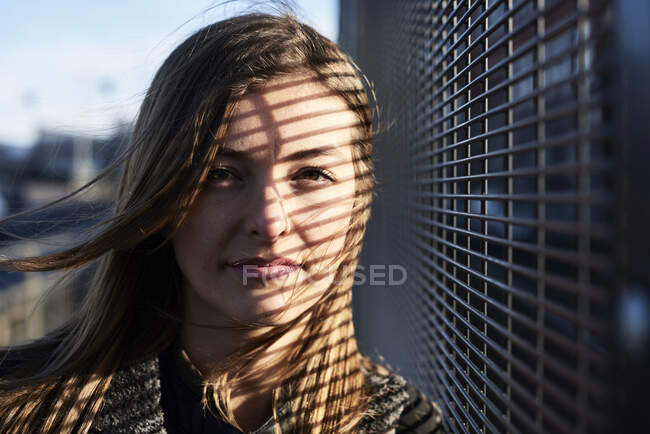 Portrait of young woman with shades on her face — Stock Photo