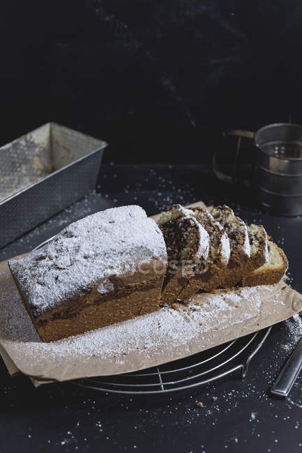 Marble cake with icing sugar, sliced — Stock Photo