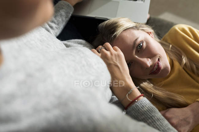 Affectionate Lesbian Couple Cuddling On The Sofa — 20 30 Years Bonding