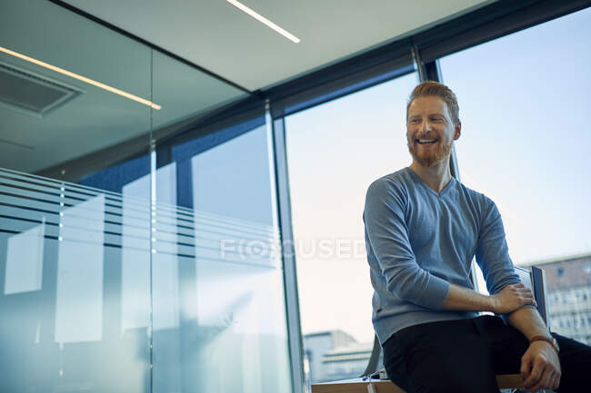 Happy businessman in office — Stock Photo