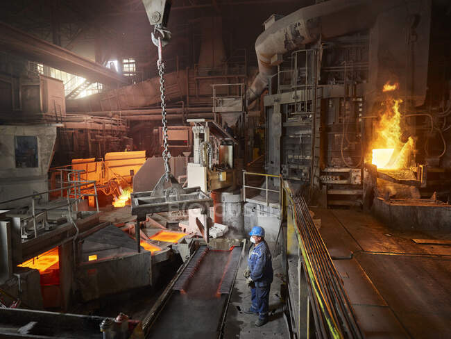 Industry, Smeltery, worker using indoor crane — copper, Protective ...