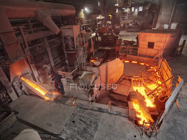 Industry, Workers controlling smelting process — Stock Photo
