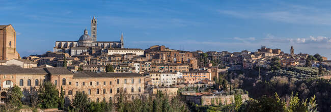 Italy, Tuscany, Siena, Basilica di San Domenico left, Siena Cathedral, University of Siena right — Stock Photo