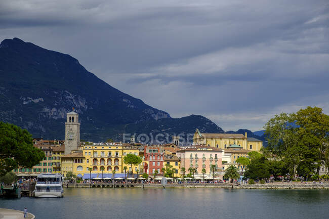 Italy, Trentino, Lake Garda, Riva del Garda, harbour with clock tower Torre Apponale — Stock Photo