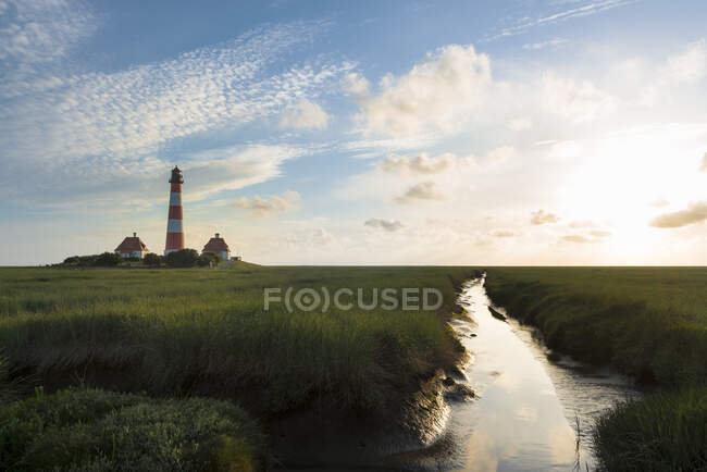 Germany, Westerhever, lighthouse in sunset — Stock Photo