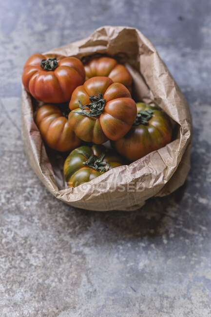 Sardinian beef tomatoes in paper bag — Stock Photo