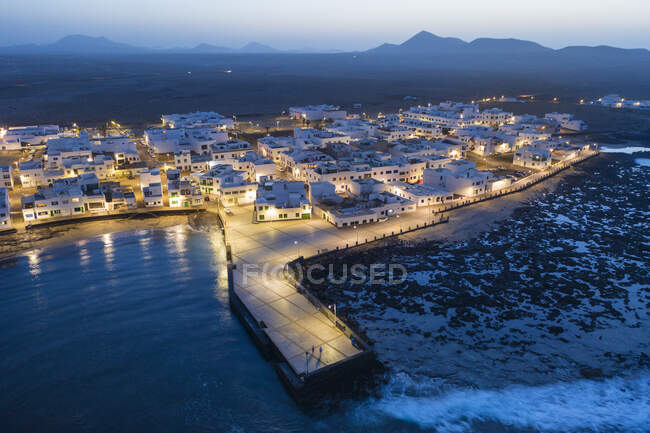 Spain, Canary Islands, Lanzarote, Caleta de Famara, dusk, aerial view — Stock Photo