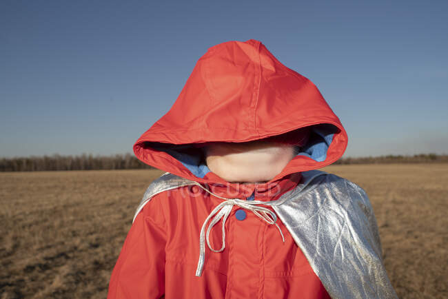 boy hiding his face