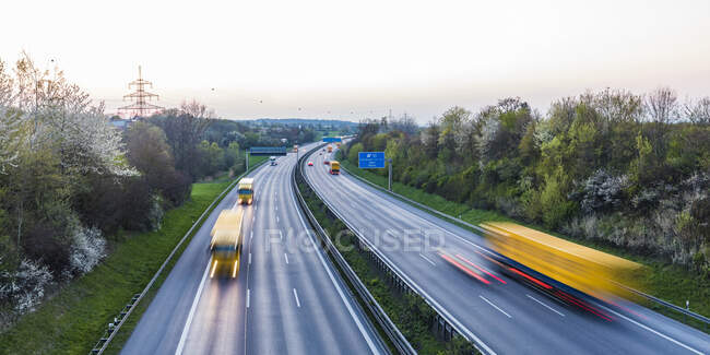 Germany, Baden-Wuerttemberg, traffic on Autobahn A8 at sunset — Stock Photo