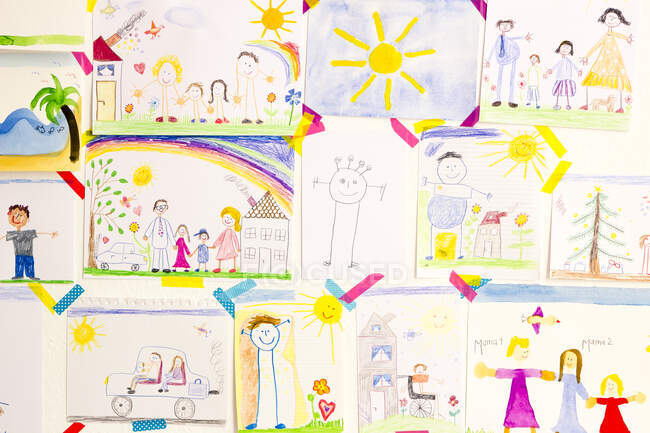 Child's drawings hanging on wall — Stock Photo