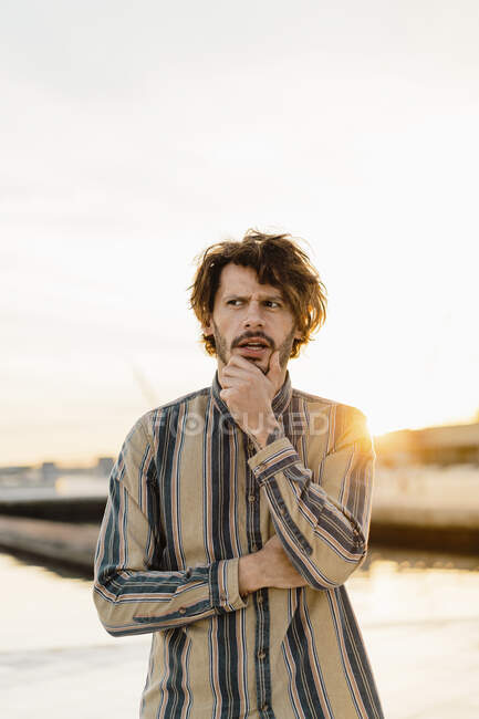 Portrait of thinking man at sunset — Stock Photo