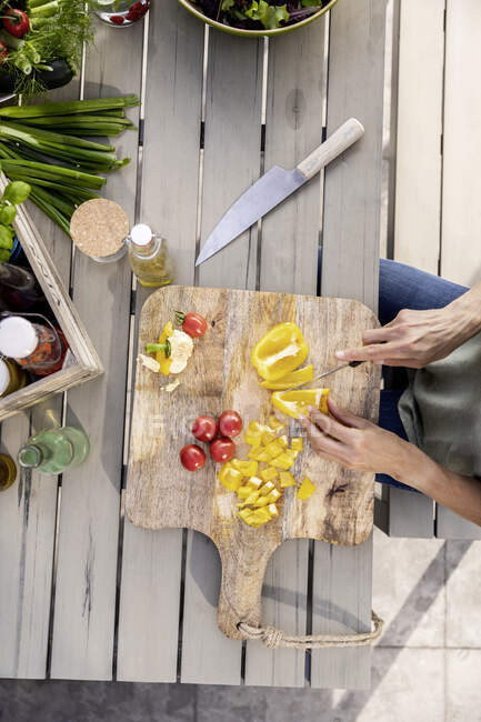 Close-up of woman preparing healthy food outdoors — Stock Photo