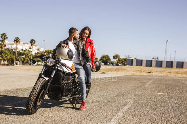 Couple sitting on motorbike — Stock Photo