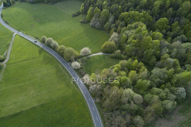 Abstract Aerial View Of Rural Road Through Landscape With Agricultural ...