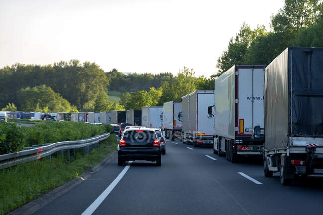 Rescue lane, cars and trucks during traffic jam in the evening, Germany — Stock Photo