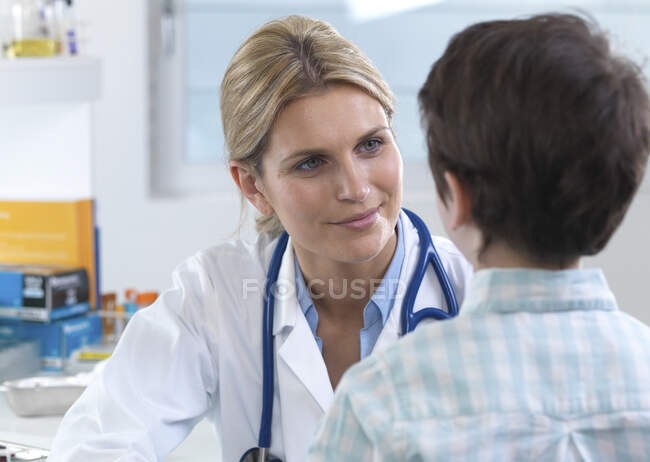 Female doctor reassuring a patient during an appointment in the clinic ...