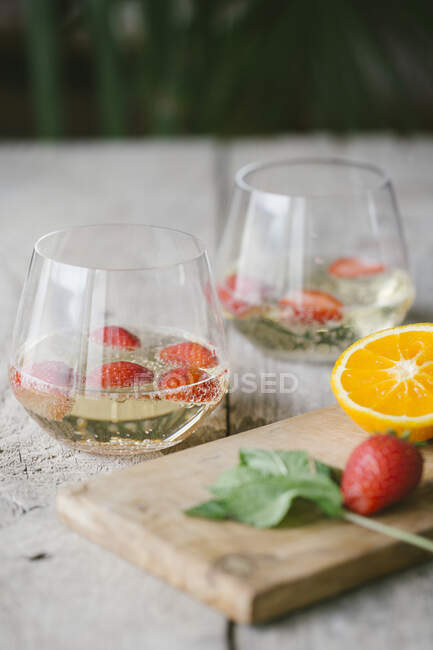Close-up of cocktail with fruits on wooden table — Stock Photo