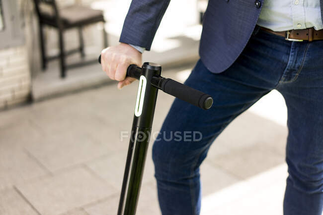 Businessman with E-Scooter, partial view — Stock Photo
