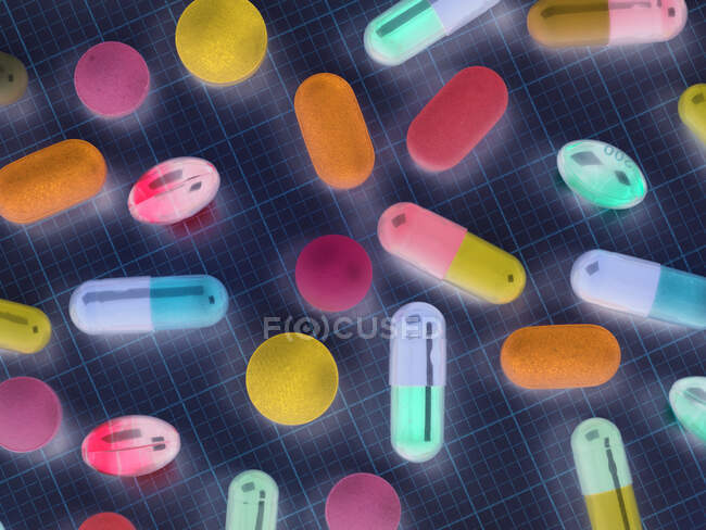 High angle view of various medicines on graph paper — Stock Photo