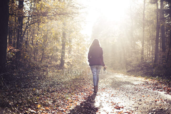 woman walking away alone