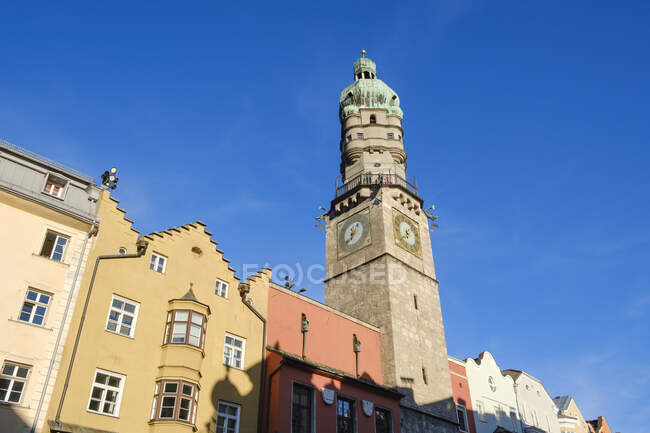 Low angle view of Stadtturm against blue sky in Innsbruck, Austria — Stock Photo