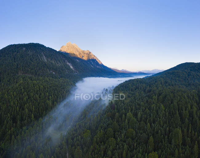Germany, Bavaria, Mittenwald, Aerial view of Ferchensee lake shrouded in morning fog — Stock Photo