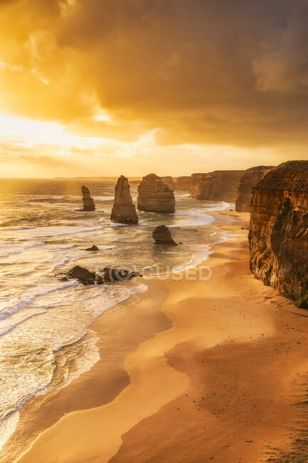 Stack rock against cloud sky at Twelve Apostles Marine National Park, Victoria, Australia — стокове фото