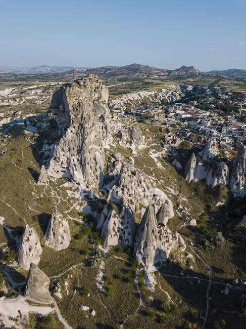 Aerial view of Uchisar castle by buildings against clear blue sky in Cappadocia, Turkey — Stock Photo