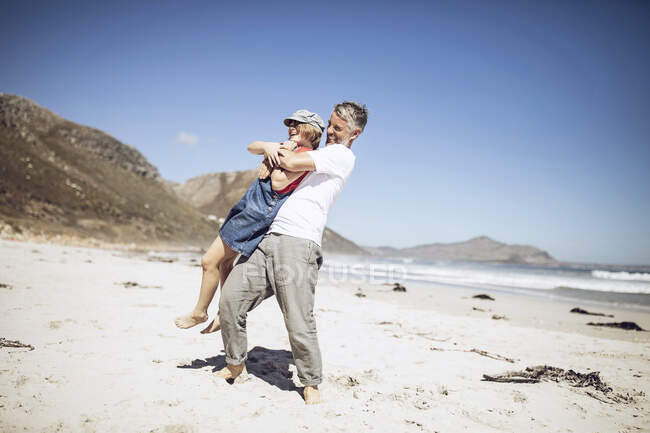 Father and daughter having fun together on the beach, Cape Town, Western Cape, South Africa — Stock Photo