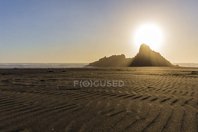 Scenic view of Karekare beach against sky during sunset, Auckland, New Zealand — Stock Photo