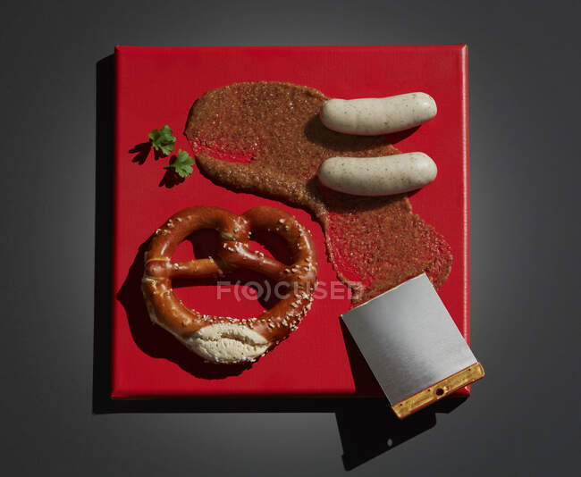 Directly above shot of meal served on red canvas over black background — Stock Photo